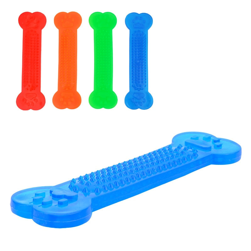 Dog chewing on rubber bone toy — aggressive chewer dental toy